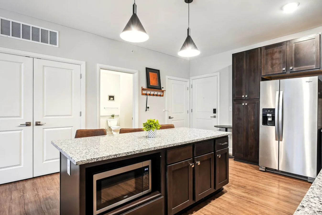 The kitchen’s open layout allows you to move freely as you prepare meals, with everything you need at your fingertips.
