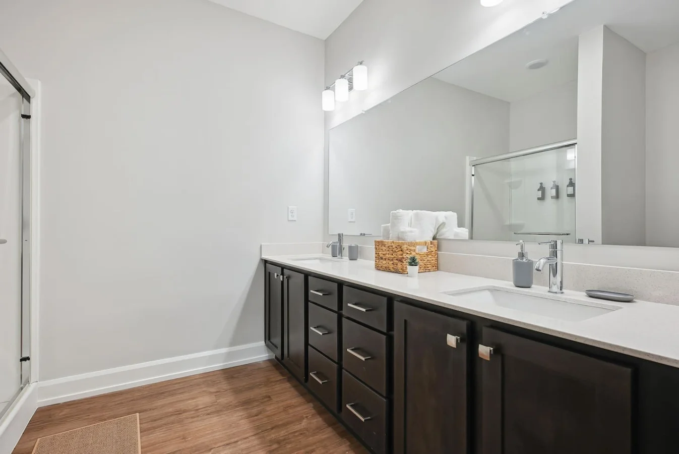 The bathroom is designed for comfort, with a spacious shower and elegant fixtures that make every moment feel luxurious.