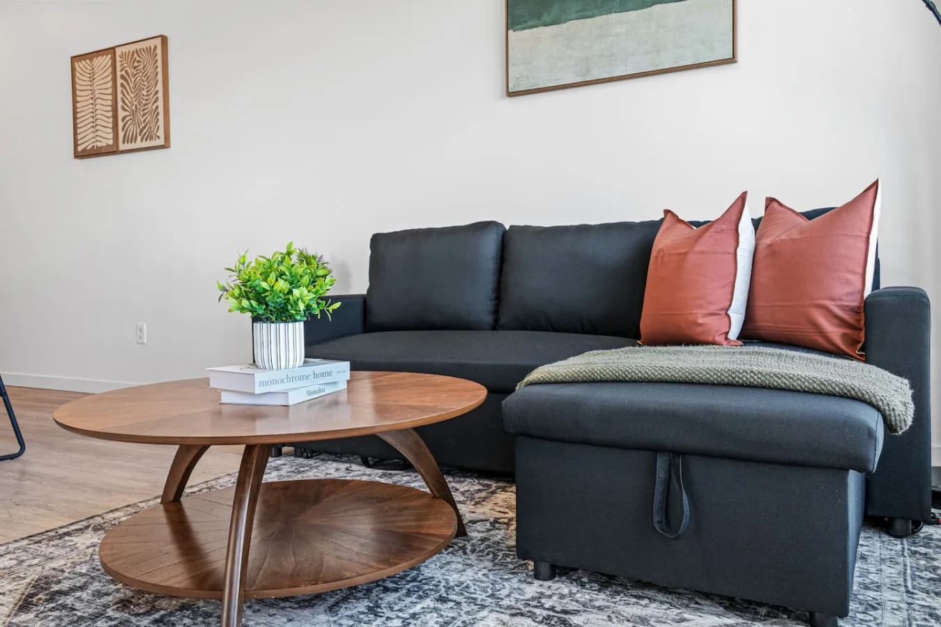 The living room is filled with natural light, creating a bright and welcoming space that invites relaxation.
