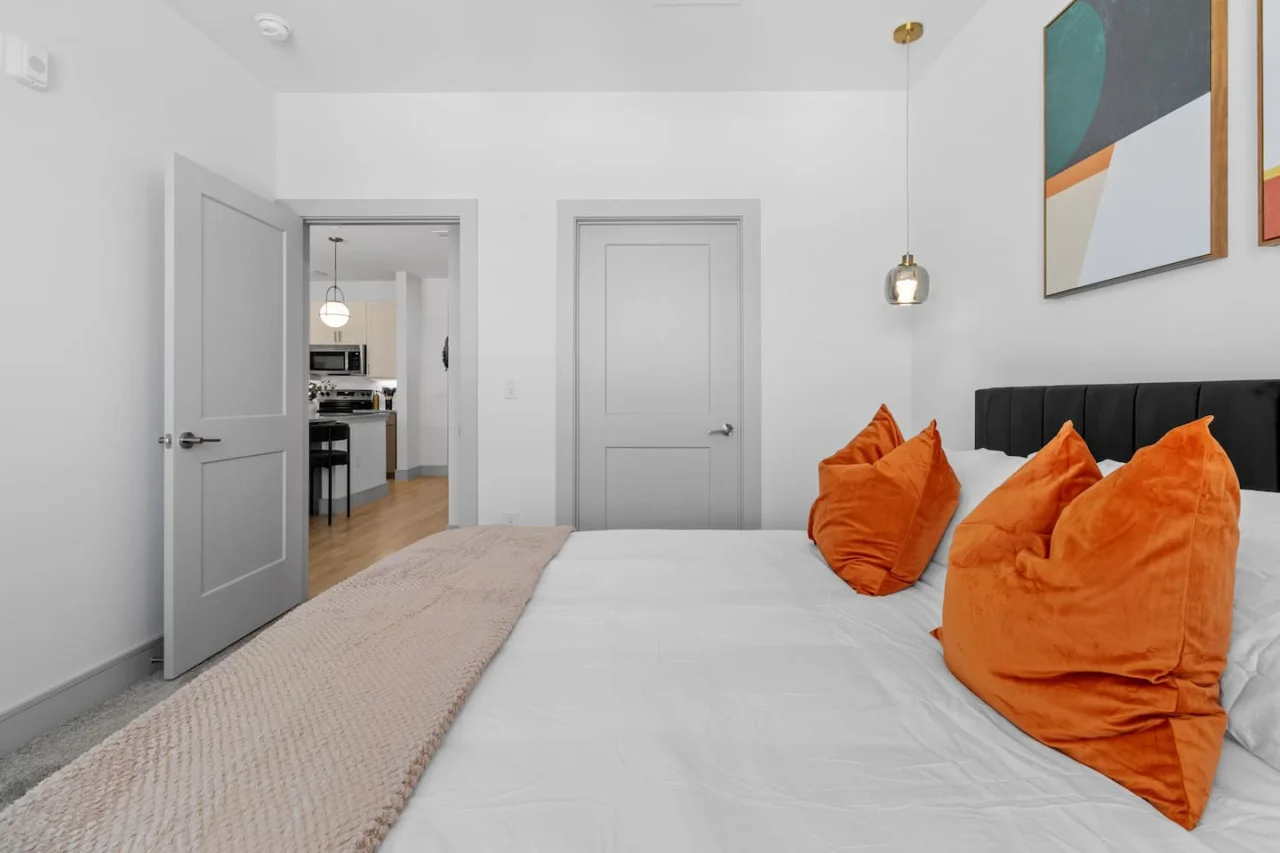 The bedroom offers a luxurious retreat, with a bed that promises restful nights and a room that feels like a private oasis.
