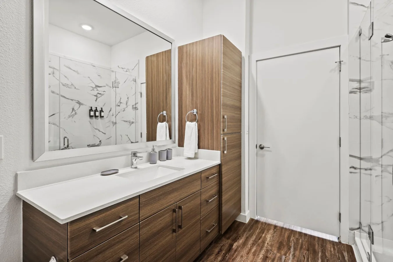 You feel a sense of calm as you enter the bathroom, where the thoughtful design and high-quality materials create a serene environment.