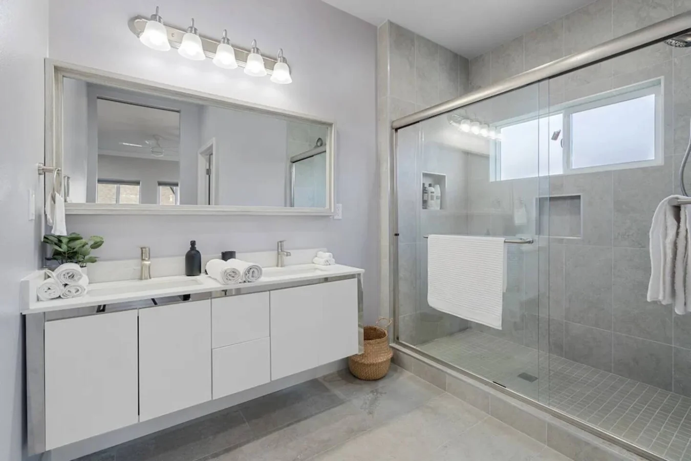 You feel a sense of calm as you enter the bathroom, where the thoughtful design and high-quality materials create a serene environment.