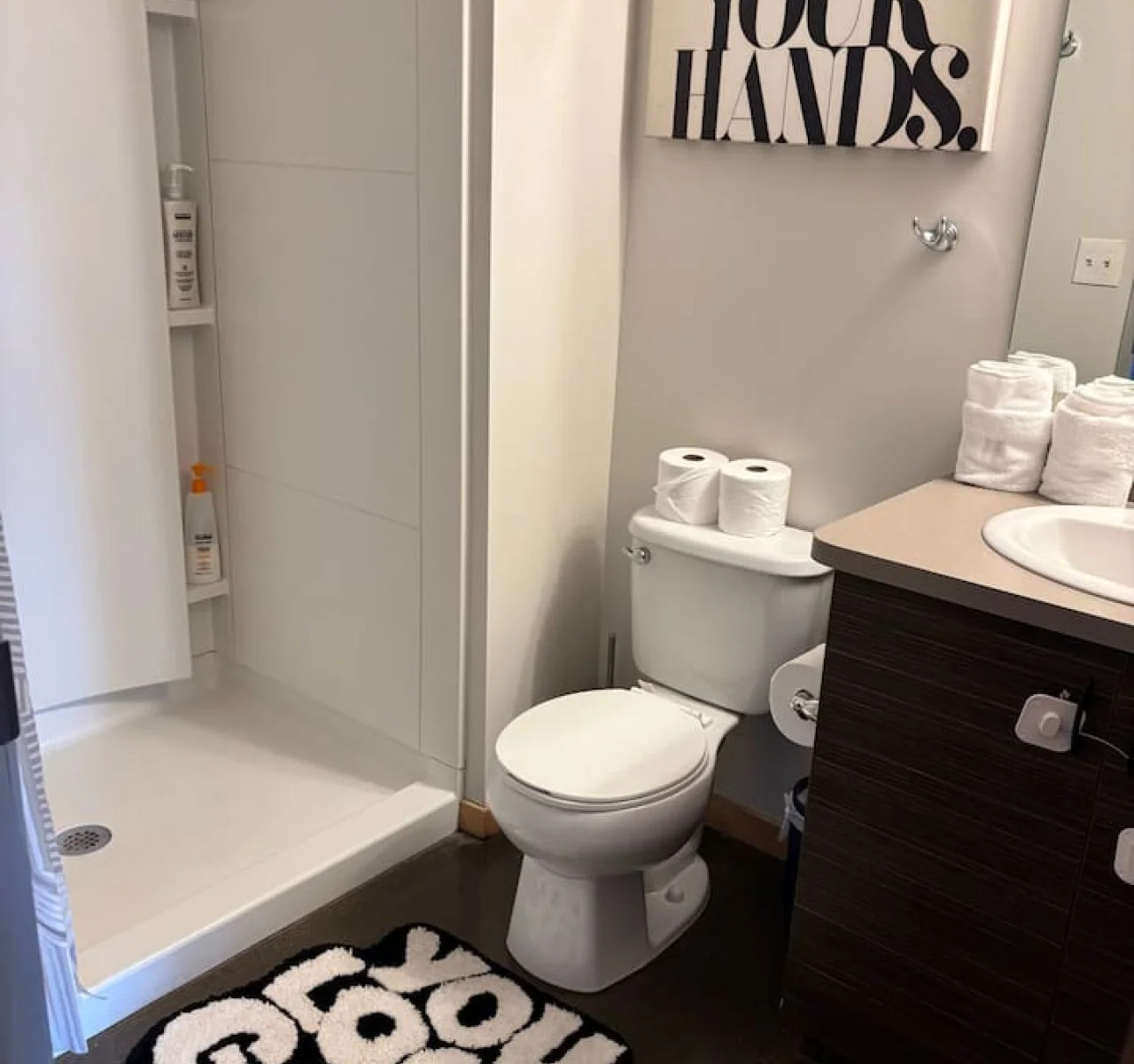 You feel a sense of calm as you enter the bathroom, where the thoughtful design and high-quality materials create a serene environment.