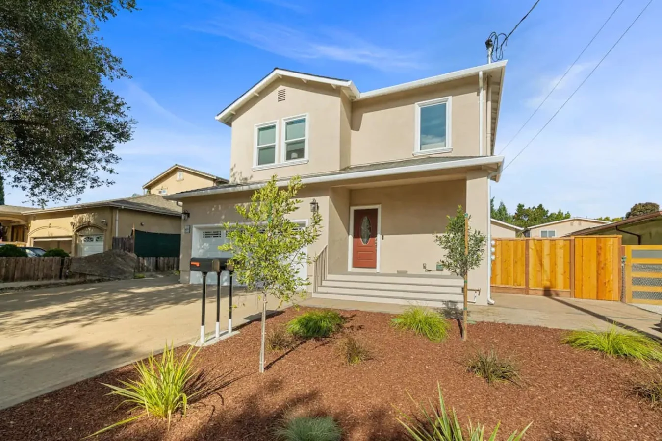 The house’s exterior is a blend of modern and classic design elements, creating a welcoming and stylish facade.