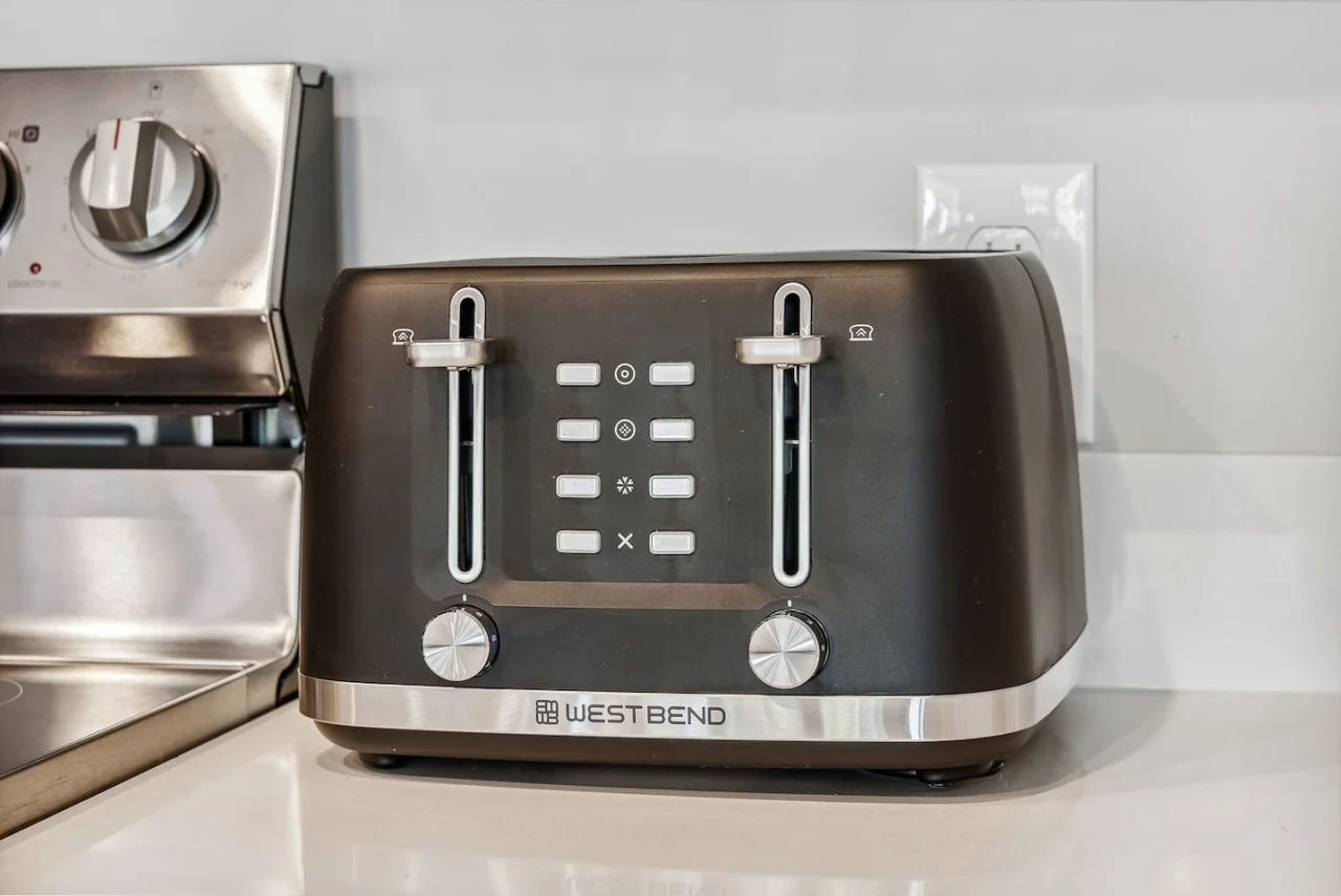 The kitchen’s open layout allows you to move freely as you prepare meals, with everything you need at your fingertips.