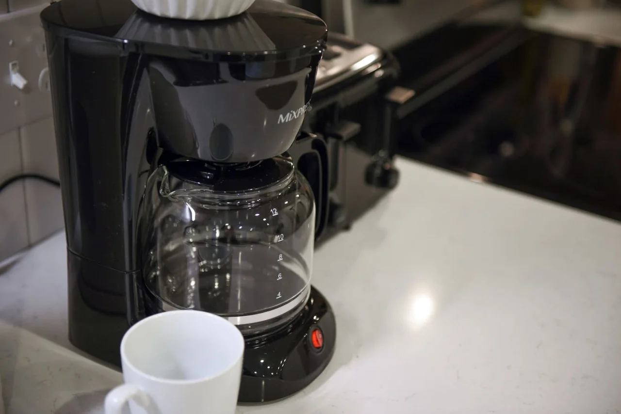The coffee station is thoughtfully equipped with a variety of in-house consumables, including a selection of ground coffee, sweeteners, and creamers to suit every taste.