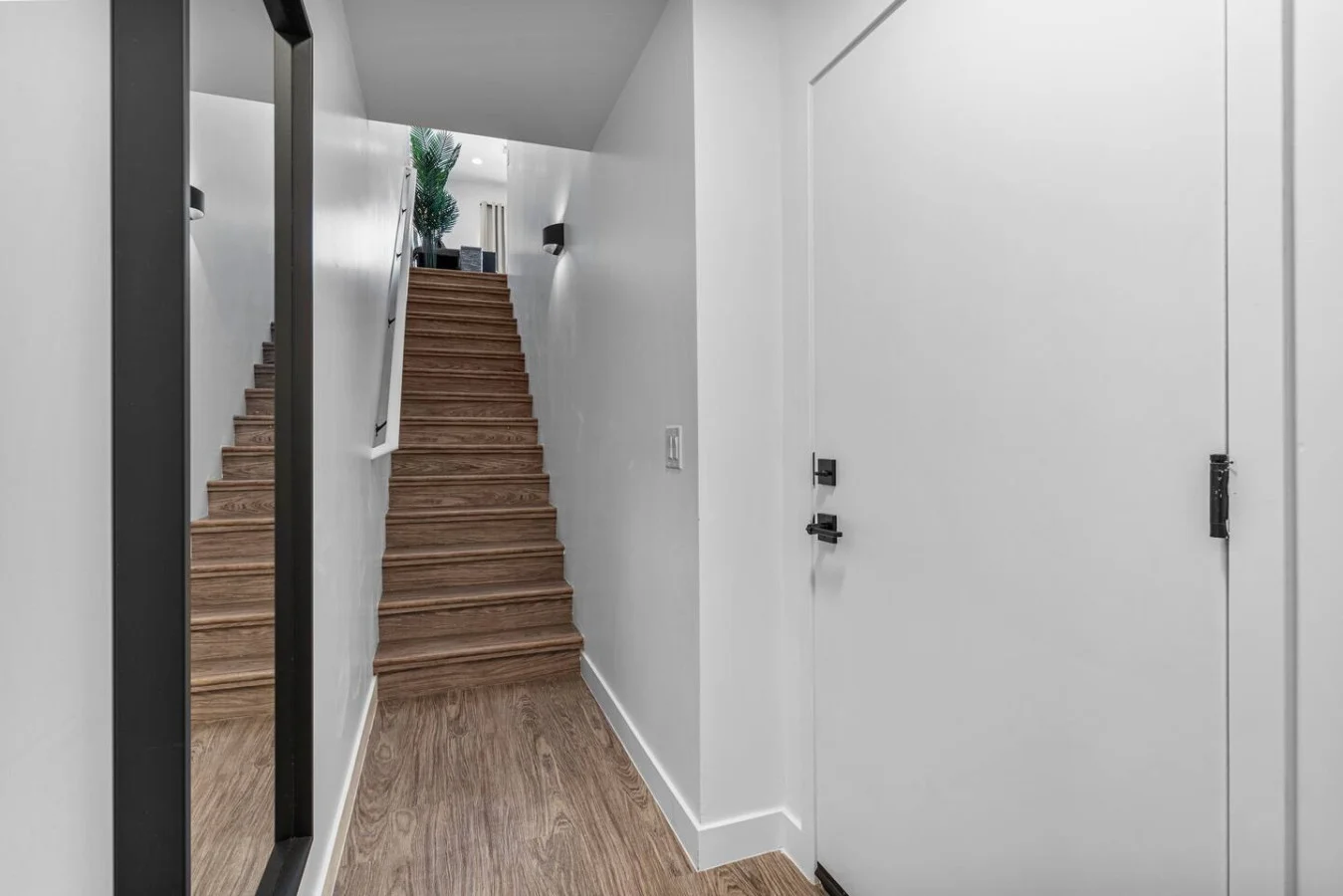 You feel a sense of continuity as you climb the stairs, moving seamlessly between the different levels of the home.