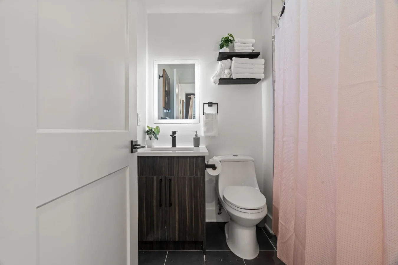 You feel a sense of calm as you enter the bathroom, where the thoughtful design and high-quality materials create a serene environment.