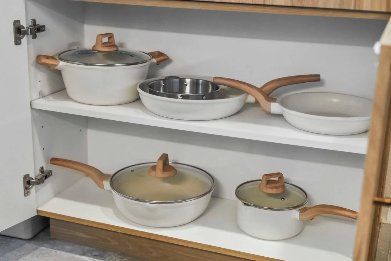 Kitchen cabinets stocked with cooking wares, glassware and silverwares, ideal for mixing up your favorite meals and drinks during your stay.