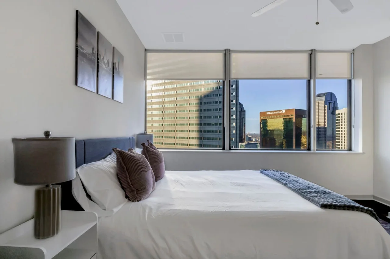 You feel enveloped in comfort as you relax on the queen bed, surrounded by a room designed for tranquility.