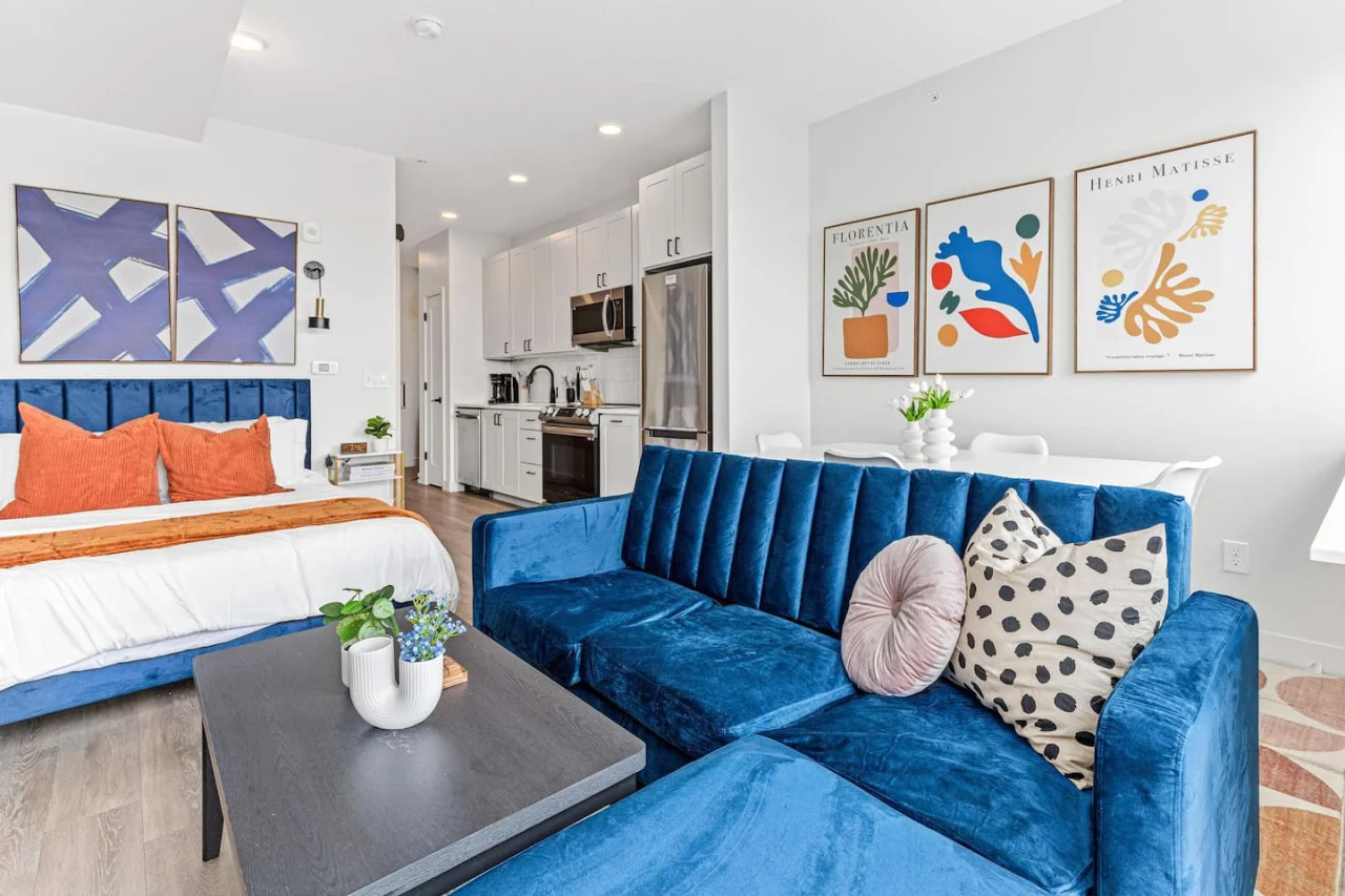 The living room is filled with natural light, creating a bright and welcoming space that invites relaxation.