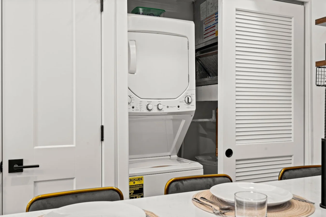 Laundry room with a washer, dryer, and folding area, offering all the convenience you need for a comfortable extended stay.