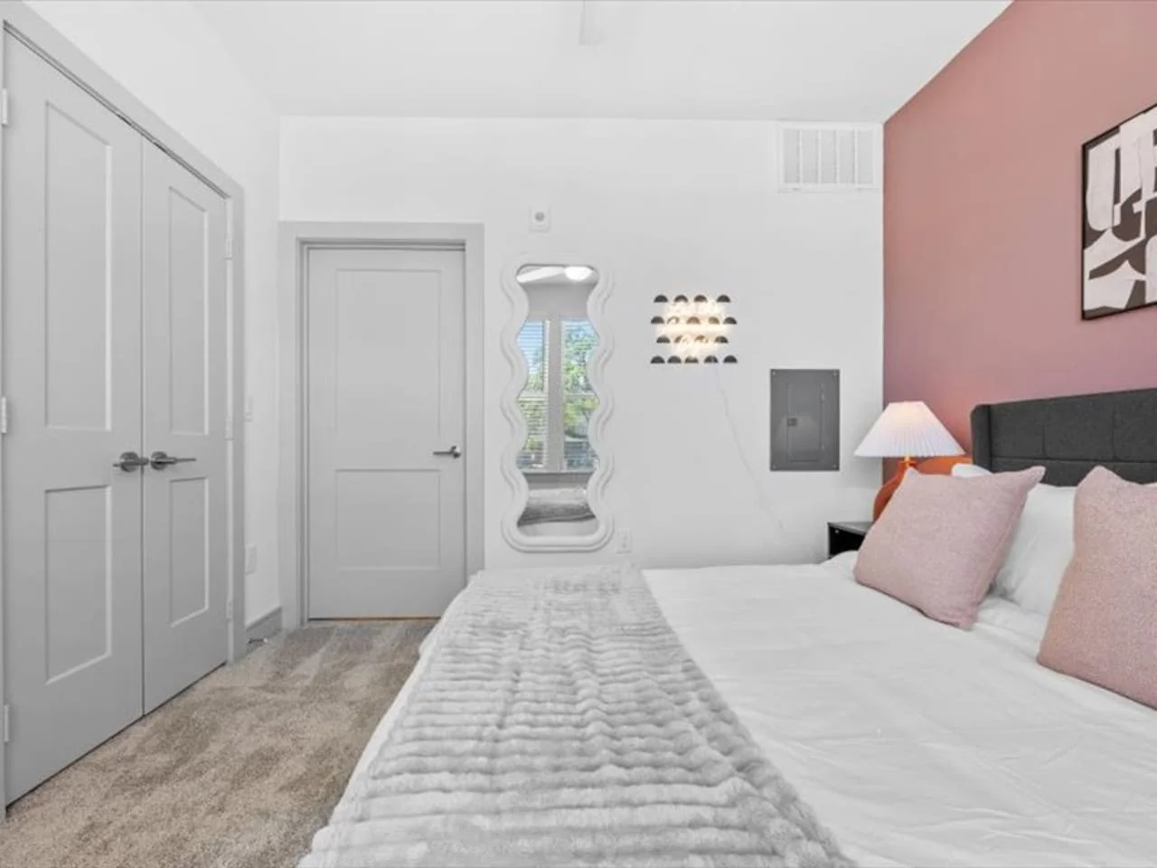 You feel enveloped in comfort as you relax on the queen bed, surrounded by a room designed for tranquility.