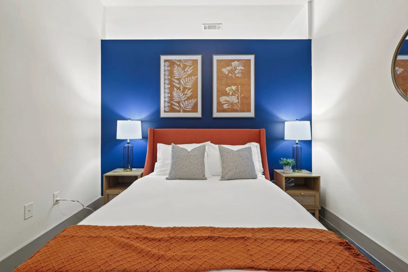 You feel enveloped in comfort as you relax on the queen bed, surrounded by a room designed for tranquility.