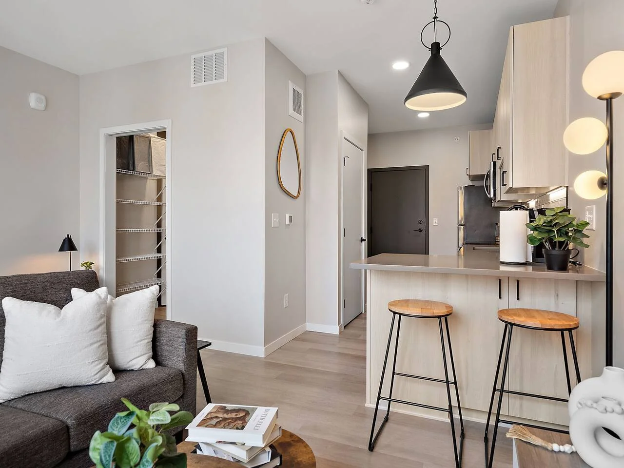 Relax in this warm, inviting space with wooden accents and cozy furnishings. You’ll love unwinding on the plush sofa, enjoying a good book or streaming your favorite shows in a serene atmosphere