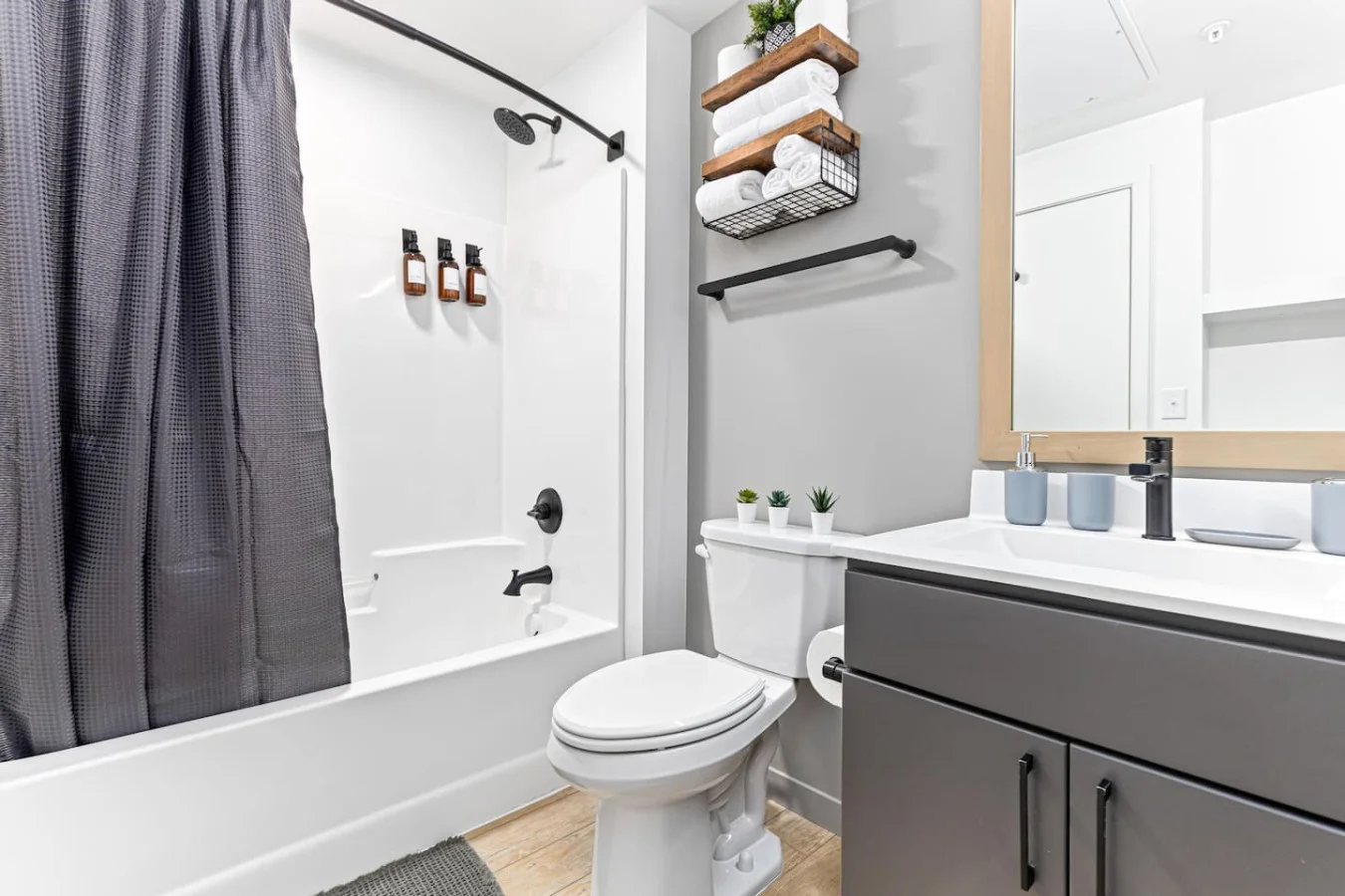 You feel a sense of calm as you enter the bathroom, where the thoughtful design and high-quality materials create a serene environment.