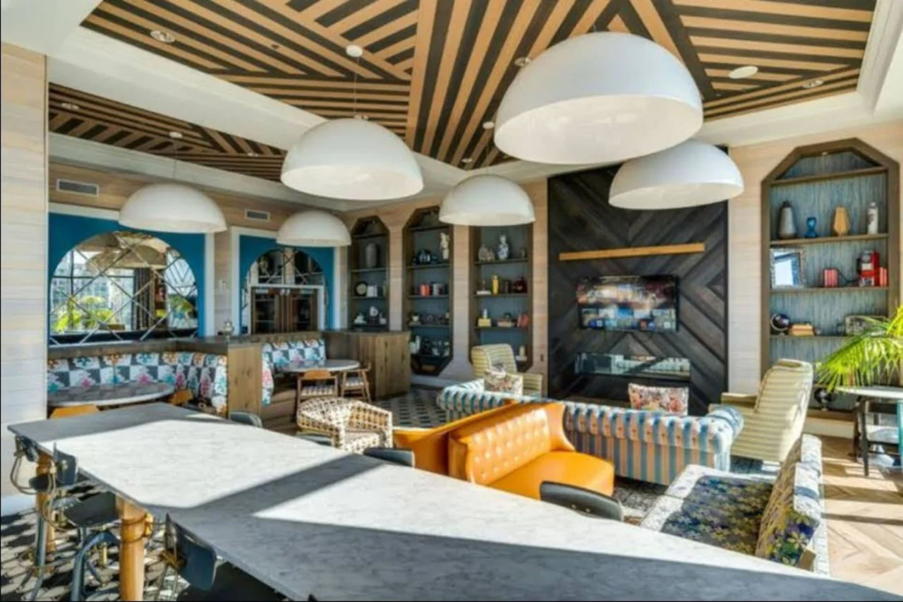 An open-concept area featuring a modern furnishings, and a stylish entertainment setup—ideal for gatherings and relaxation.
