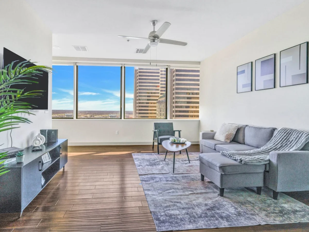 The living room’s cozy vibe makes it the perfect spot to relax, with ample seating and a warm ambiance.