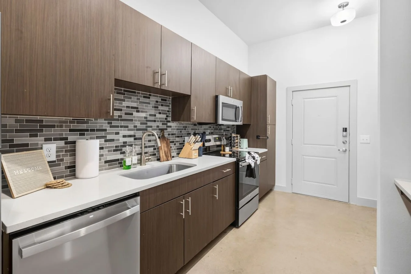 Bright and functional kitchen space designed with clean lines and premium stainless steel finishes.
