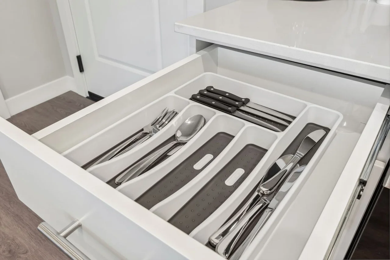 Kitchen utensils with scissors, measuring cups, grater, wine opener, can opener
