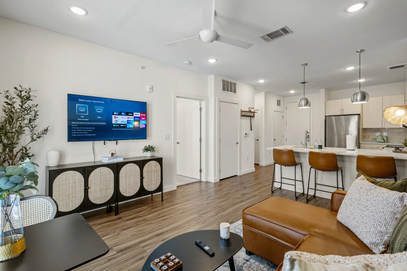 The living room is filled with natural light, creating a bright and welcoming space that invites relaxation.