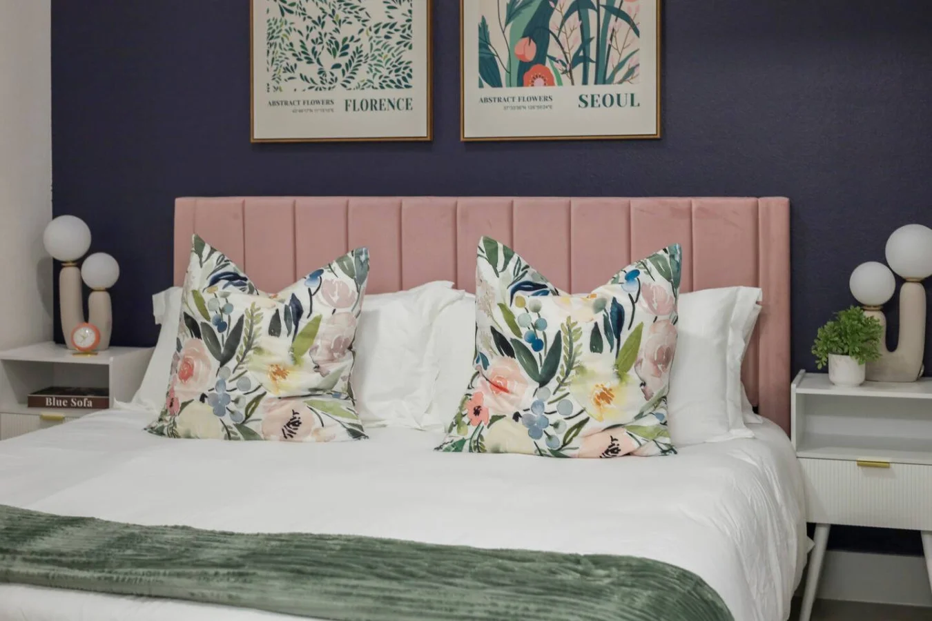 You feel enveloped in comfort as you relax on the queen bed, surrounded by a room designed for tranquility.