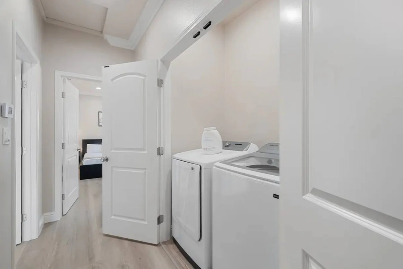 Convenient laundry room with washer, dryer, and all necessary supplies, making it easy to take care of your laundry needs.