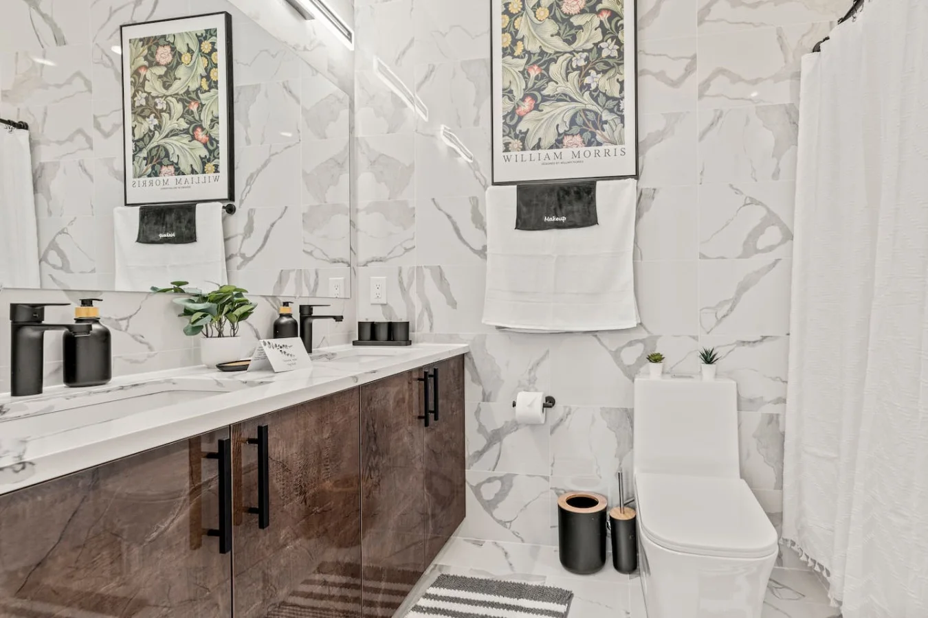 You feel a sense of calm as you enter the bathroom, where the thoughtful design and high-quality materials create a serene environment.