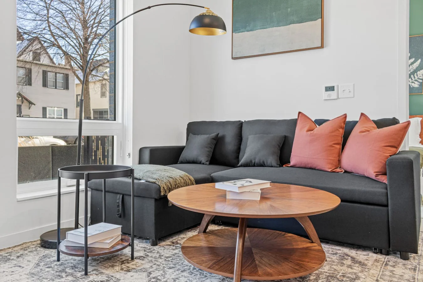 You feel a sense of peace as you step into the living room , with its inviting decor and soothing tones.