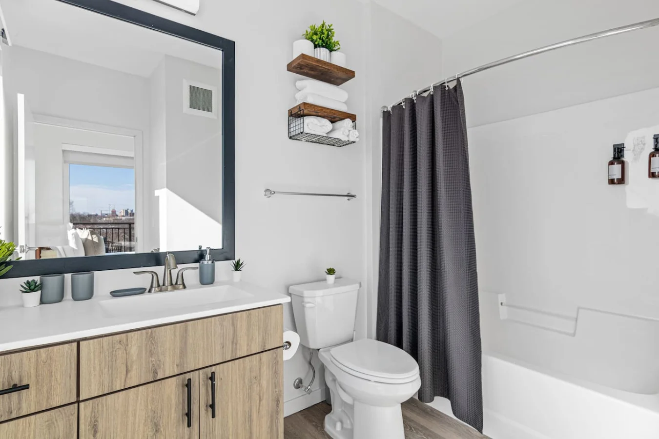 You feel a sense of calm as you enter the bathroom, where the thoughtful design and high-quality materials create a serene environment.