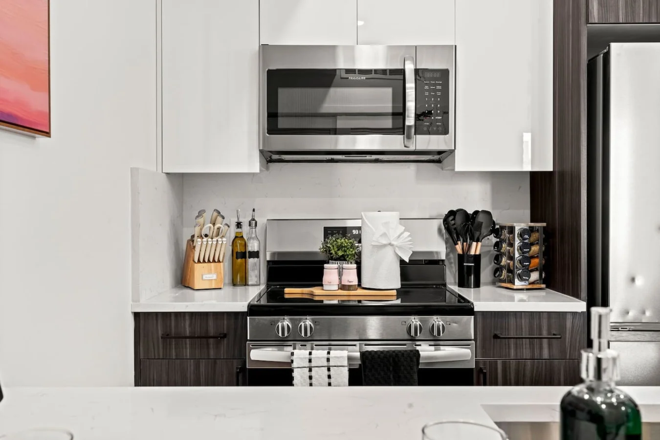 Electric stove with complete knife set, utensil set, and a plethora of spices.