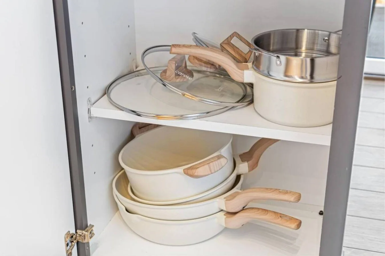 Kitchen cabinets stocked with cooking wares, glassware and silverwares, ideal for mixing up your favorite meals and drinks during your stay.