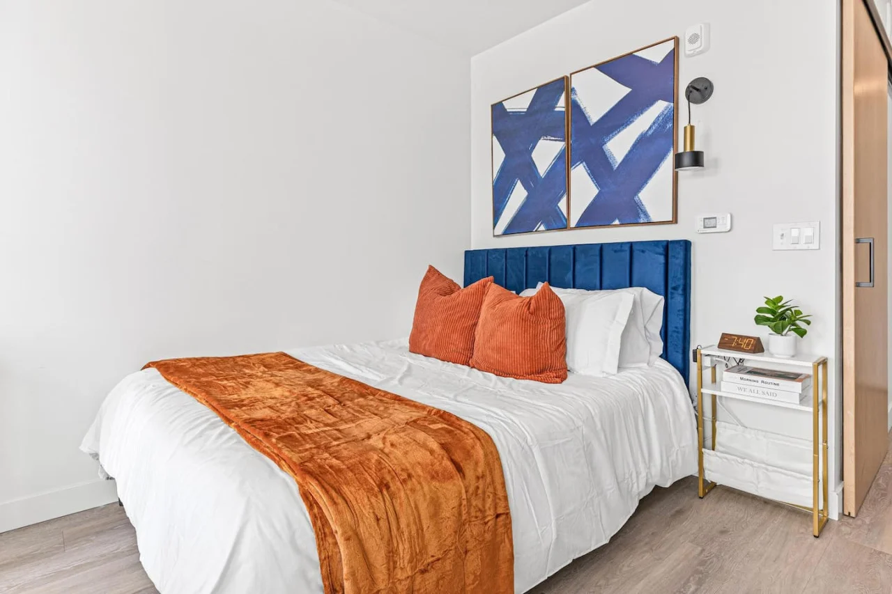 The bedroom’s serene ambiance invites you to relax, with a plush bed that promises a restful night's sleep.