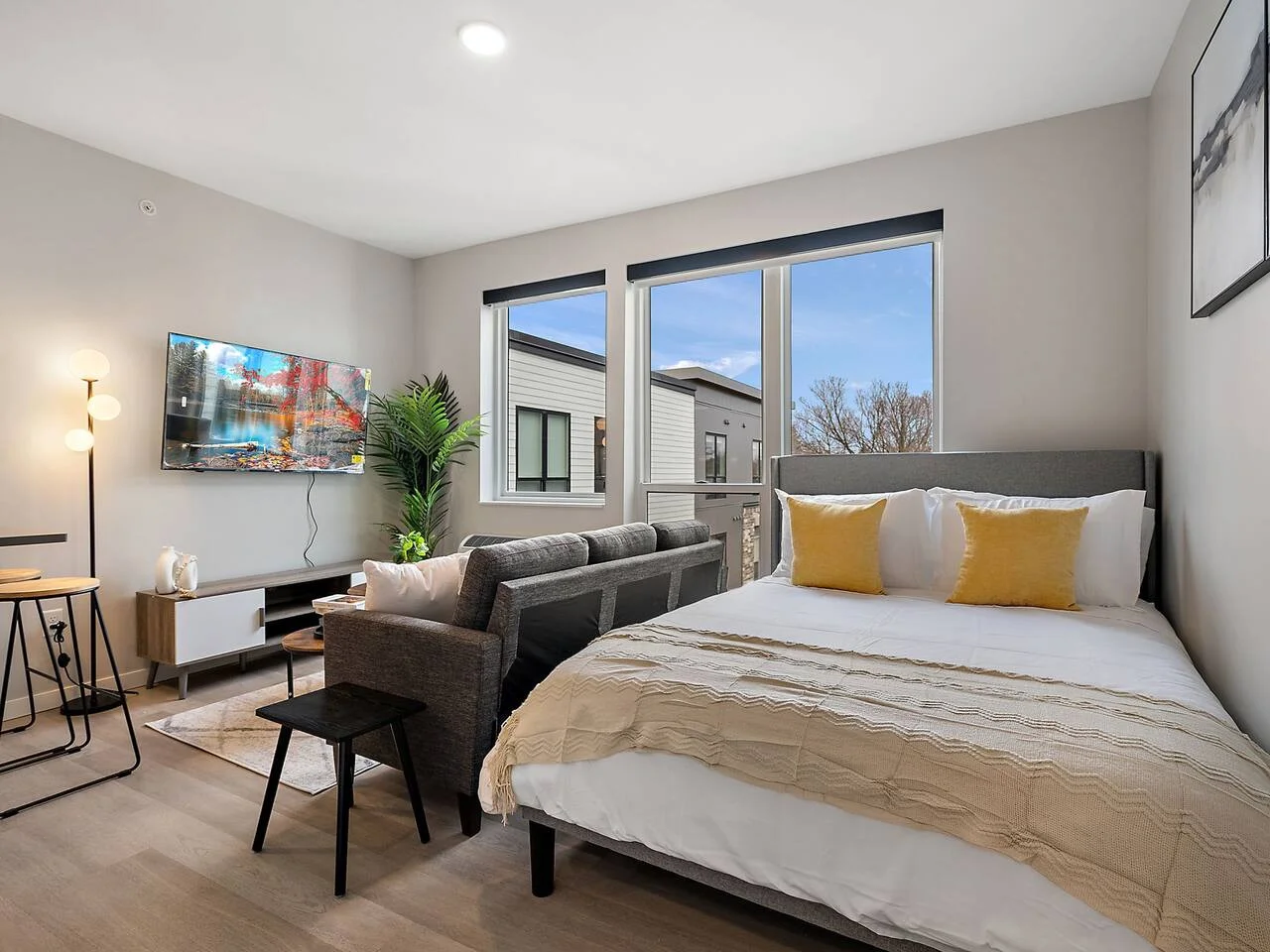 The bedroom offers a luxurious retreat, with a bed that promises restful nights and a room that feels like a private oasis.