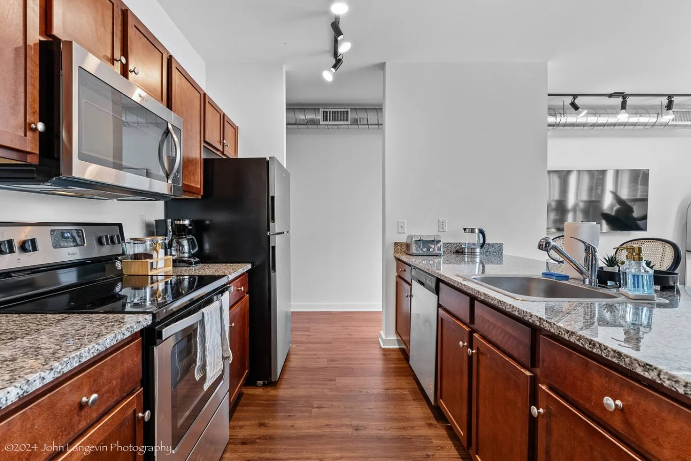 As you open the kitchen, you discover an assortment of coffee pods, and sugar, ensuring you have everything you need for a perfect morning or afternoon pick-me-up.