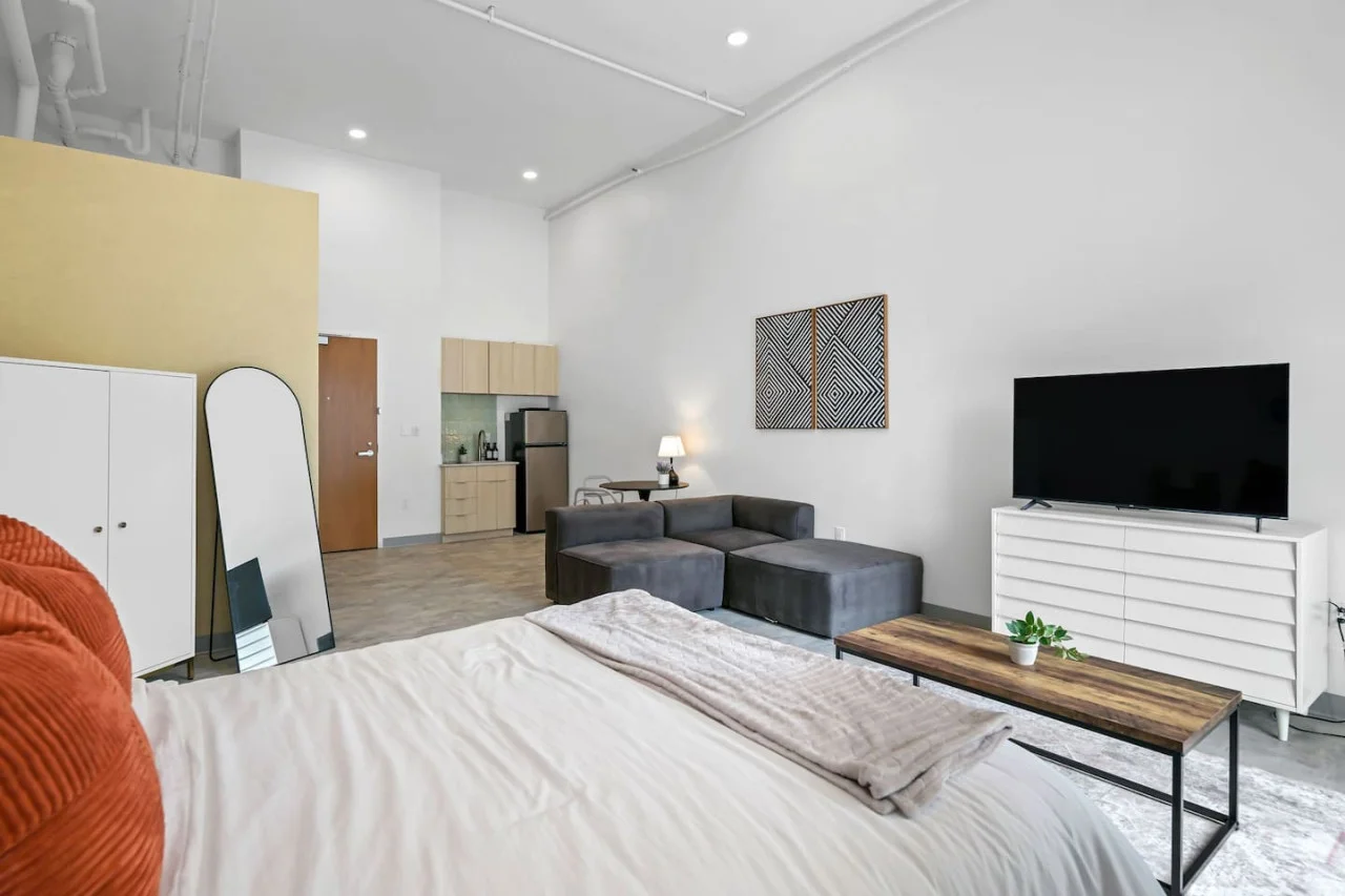 You feel enveloped in comfort as you relax on the queen bed, surrounded by a room designed for tranquility.