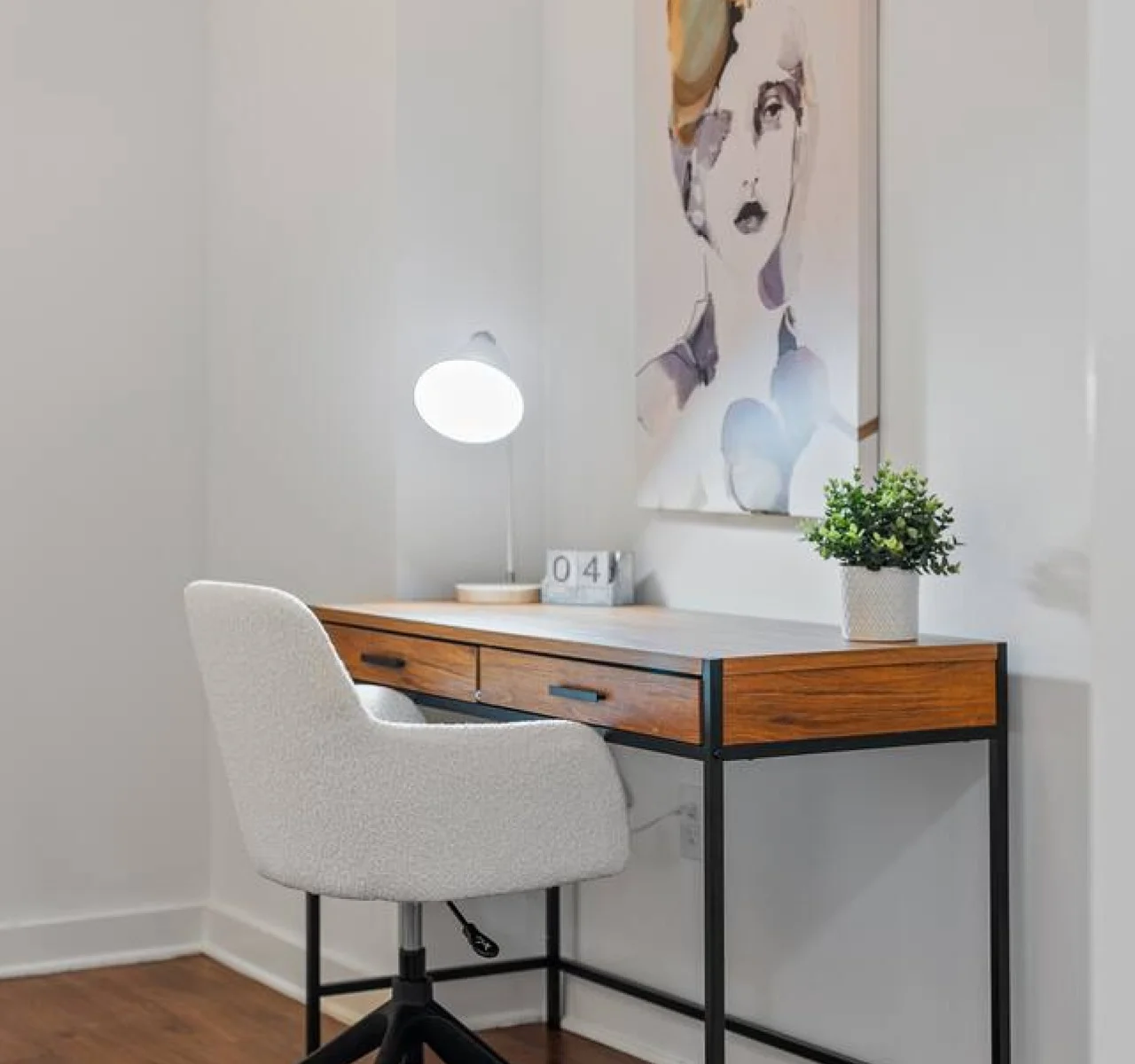 This cozy workspace with warm lighting, and a creative wall display, perfect for productivity.