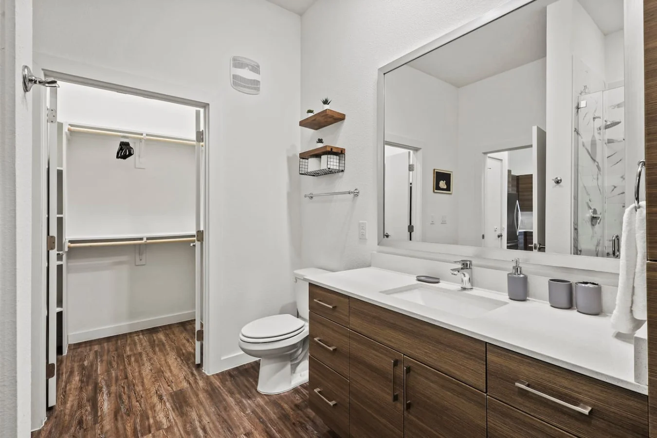 You feel a sense of calm as you enter the bathroom, where the thoughtful design and high-quality materials create a serene environment.