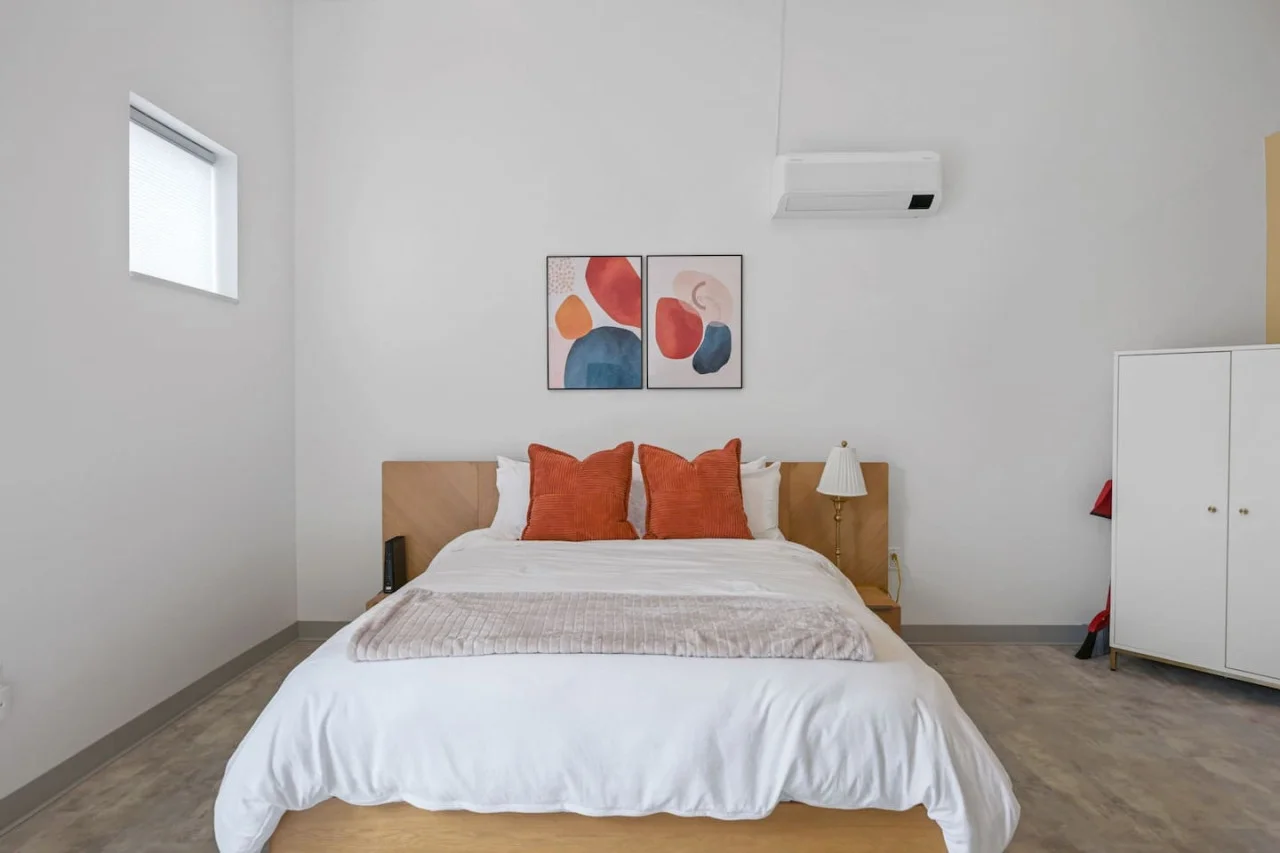 You feel enveloped in comfort as you relax on the queen bed, surrounded by a room designed for tranquility.