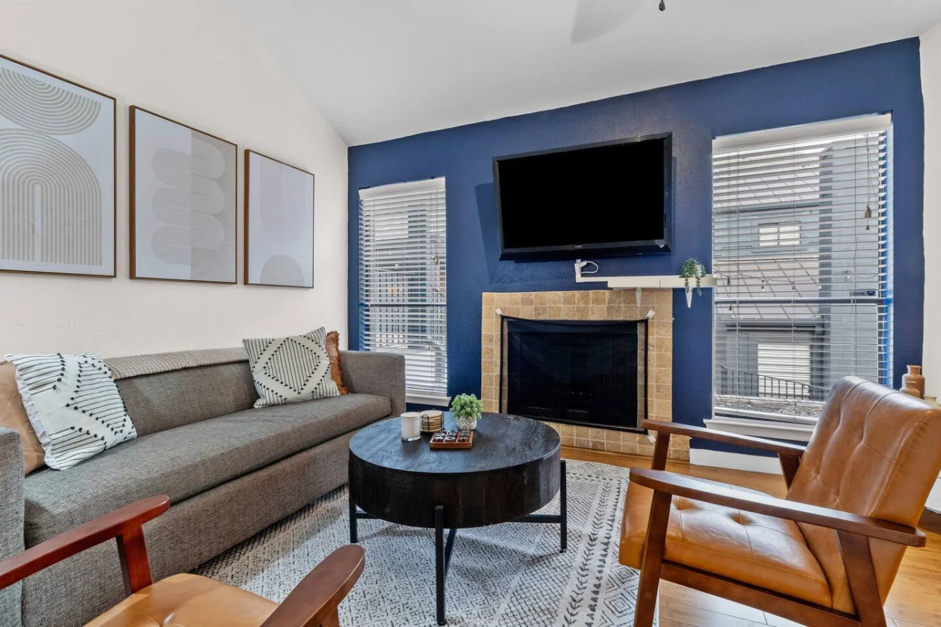 Comfortable sofa and accent chairs in a sun-filled space