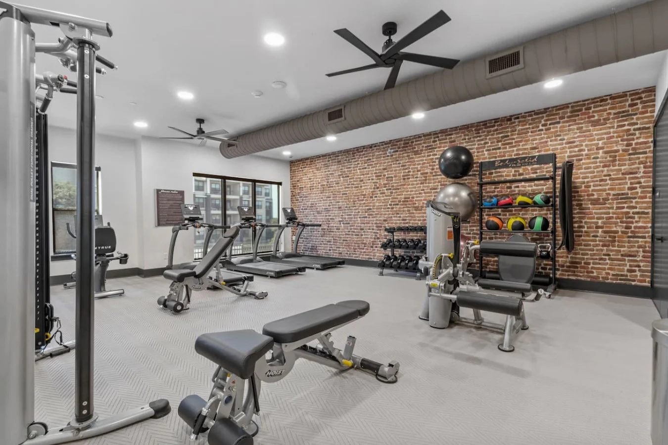 Versatile workout area featuring mats, yoga balls, and foam rollers to energize your warm-ups and strengthen your core.