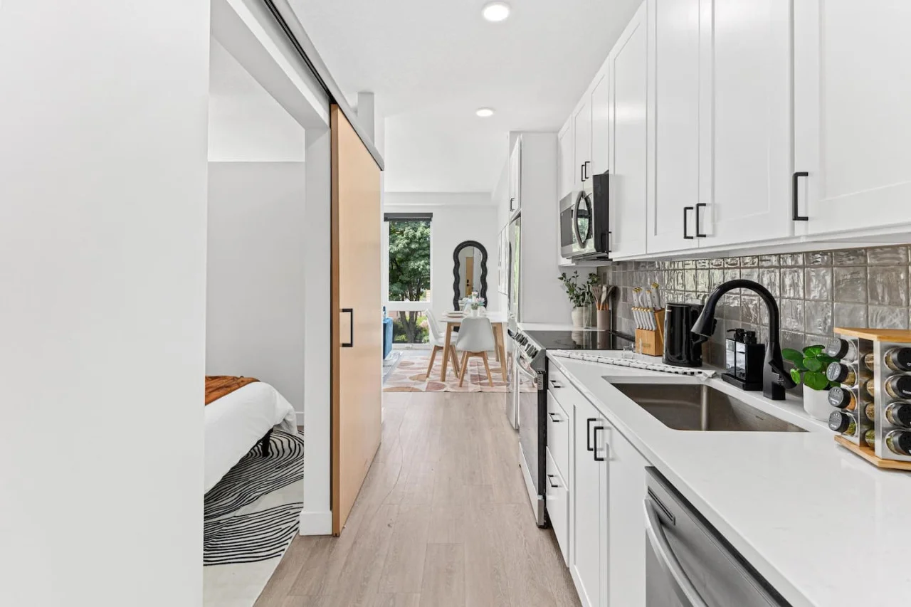 Front hallway - Fully equipped kitchen w/ Stainless steel appliances - Microwave - Dishwasher - Fridge & Freezer - Stove - Sink - Spice rack - Kettle - Coffee maker - Knife block - Decorative accents and more.