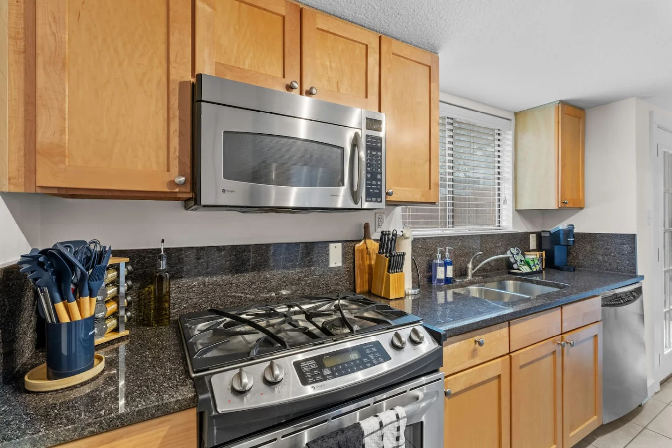 Fully equipped kitchen with gas range and modern appliances
