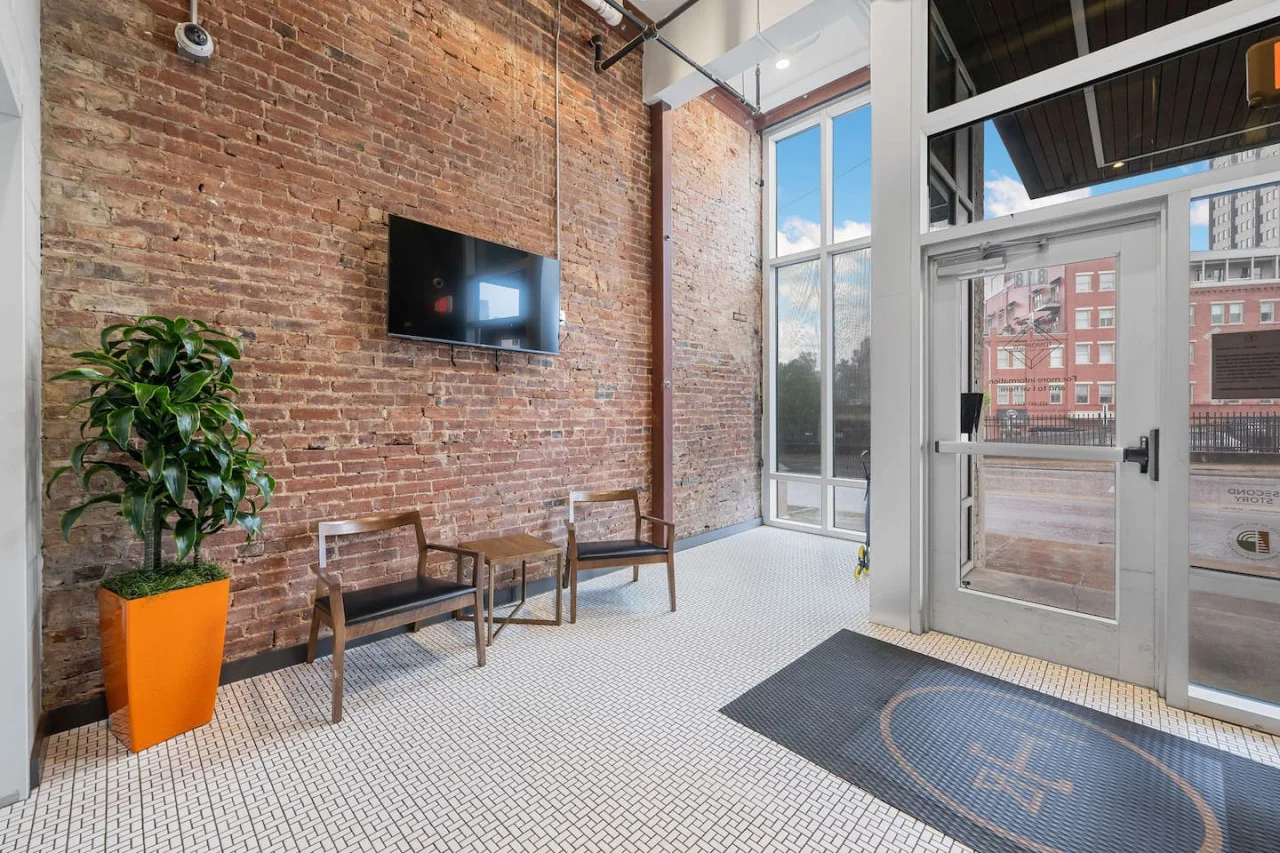The living room is filled with natural light, creating a bright and welcoming space that invites relaxation.