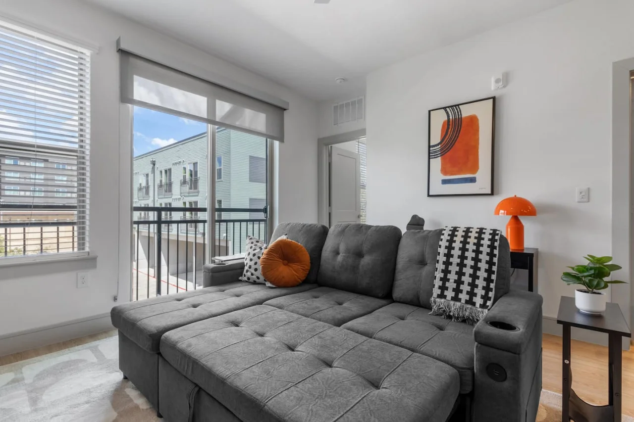 Spacious living room with stylish decor, perfect for unwinding after a day of exploring the local area.