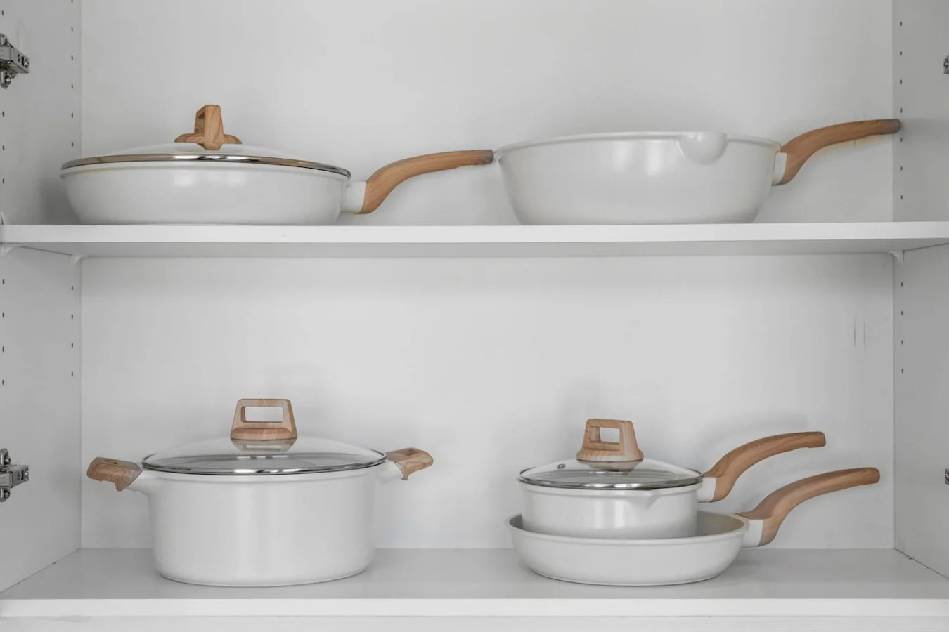 Kitchen cabinets stocked with cooking wares, glassware and silverwares, ideal for mixing up your favorite meals and drinks during your stay.