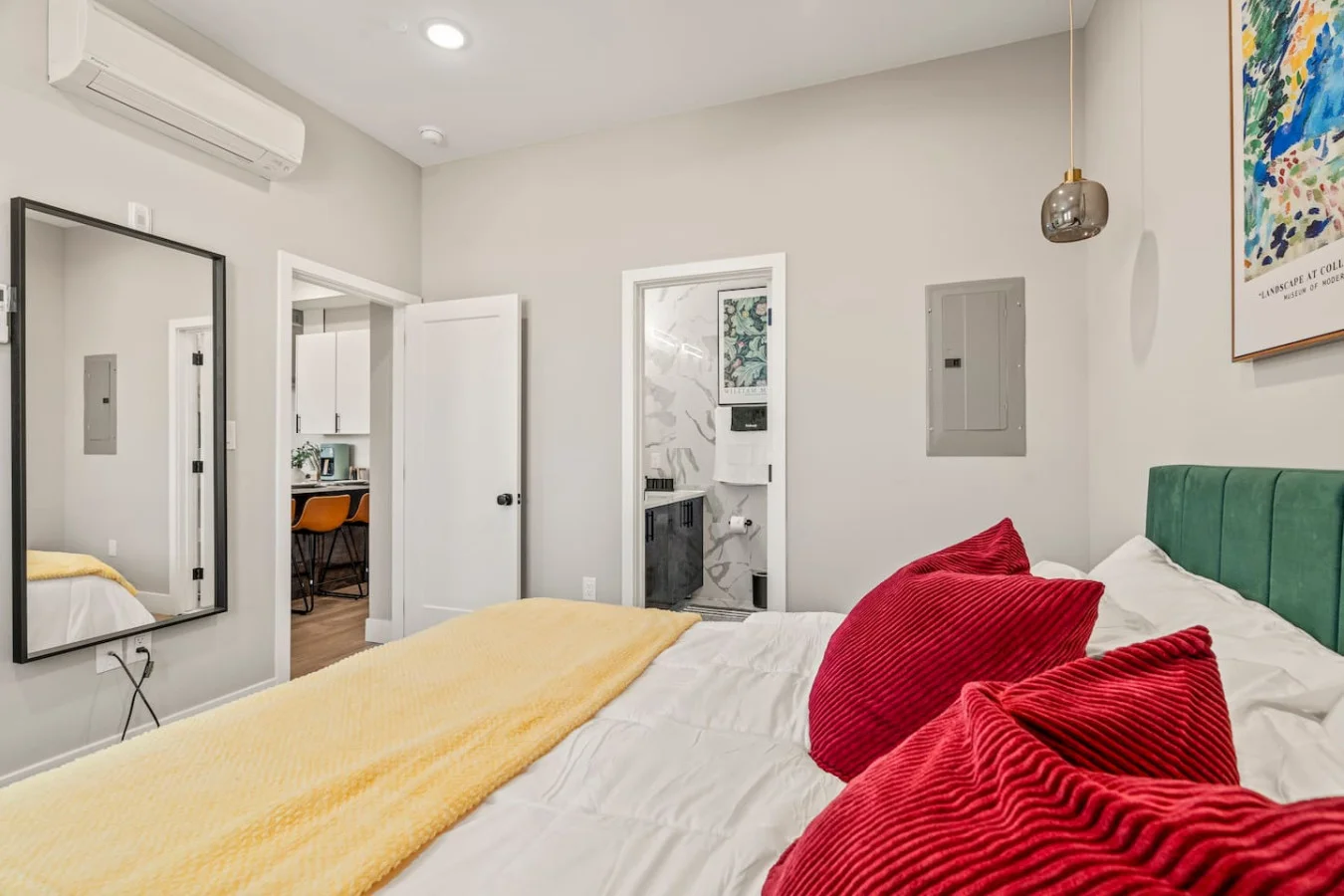 You feel enveloped in comfort as you relax on the queen bed, surrounded by a room designed for tranquility.