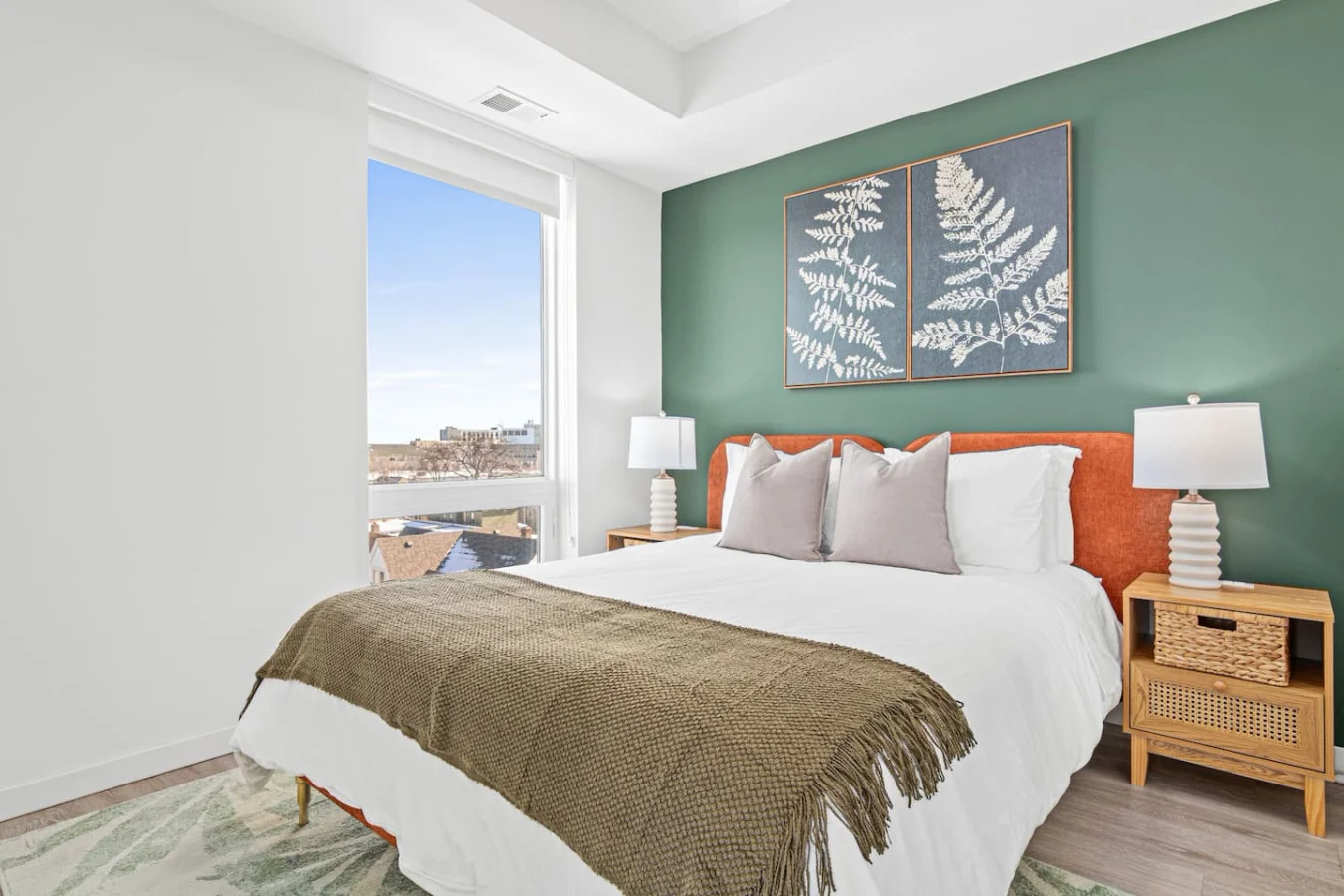 The bedroom’s serene ambiance invites you to relax, with a plush bed that promises a restful night's sleep.