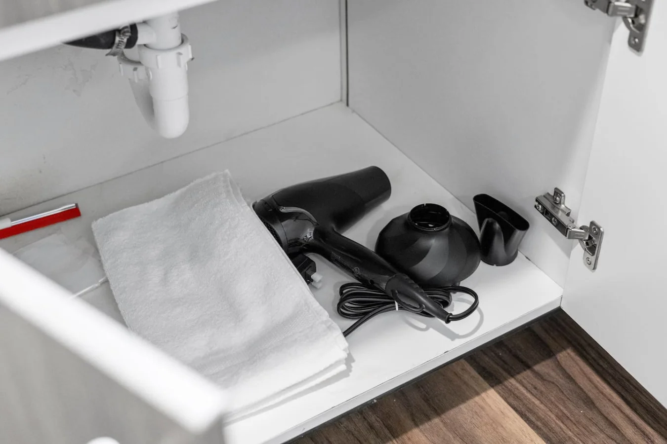 Sleek closet doors hide plenty of storage space, ensuring your room remains open and tidy during your stay.