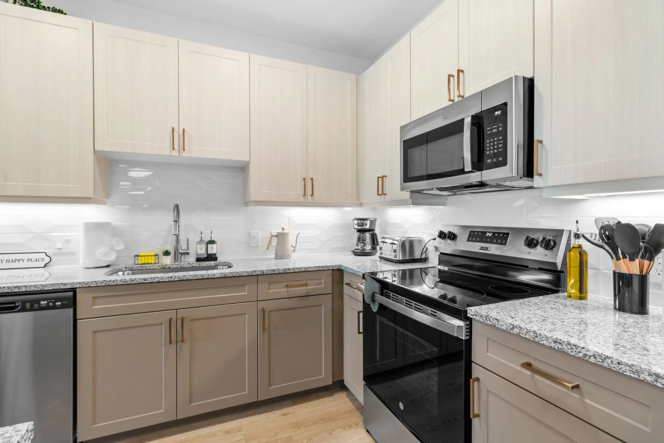 Ready to cook with flair? This kitchen’s stainless steel appliances, generous cabinetry, and trendy backsplash combine style and function for every meal, big or small.